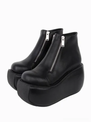 Paired black Gothic Lolita wedge platform ankle boots with silver front zippers, front three-quarter view showing round toe caps and ultra-thick platform soles