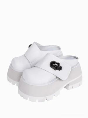 White Gothic Lolita platform mule sandals with skull buckle ornament front three-quarter view studio shot