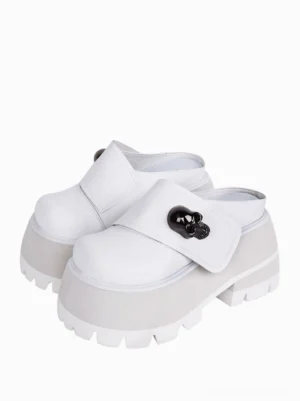 White PU leather platform mule loafers with black metal skull decoration chunky platform sole front angle