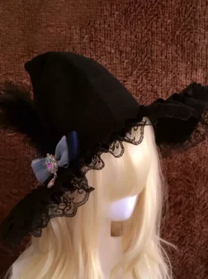 Gothic lolita black witch hat right rear side angle showing black feather accent and layered lace ruffle details