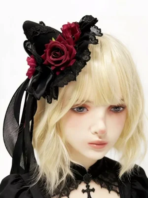 Gothic lolita witch hat hair clip with black lace and wine red fabric roses, modeled with blonde lolita girl wearing black lace Gothic dress with cross choker, front view close-up