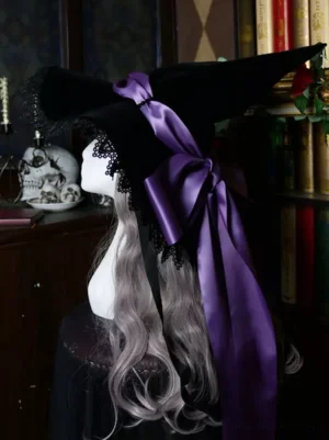 Gothic lolita witch hat with purple satin bow and lace trim worn on mannequin, left rear side view showcasing black velvet fabric texture and oversized bow details