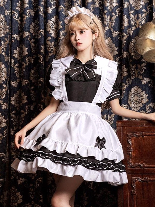 Black gothic maid dress lolita style back three-quarter view showing ruffled apron and layered skirt details with bow accents