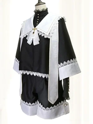 Front view of Gothic Ouji black and white lace coat on dress form displaying bow brooch and flared lace-trimmed sleeve cuffs against white background