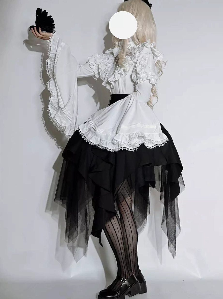 Gothic Ouji Lolita black tulle skirt detail view showing asymmetrical construction high-waist design corset-inspired waistband and tulle layering technique