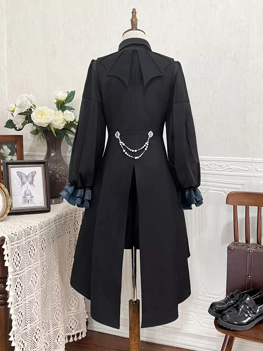 Back view of Gothic Ouji Lolita coat set revealing bow-shaped back detail, waist metal chain accent, and voluminous puff sleeves on vintage background