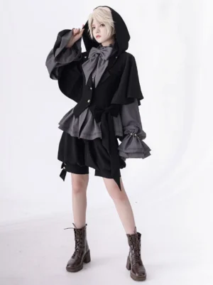 Gothic Ouji Lolita hooded overcoat front full body view with layered ruffled sleeves and hood fastened on blonde model in white studio setting