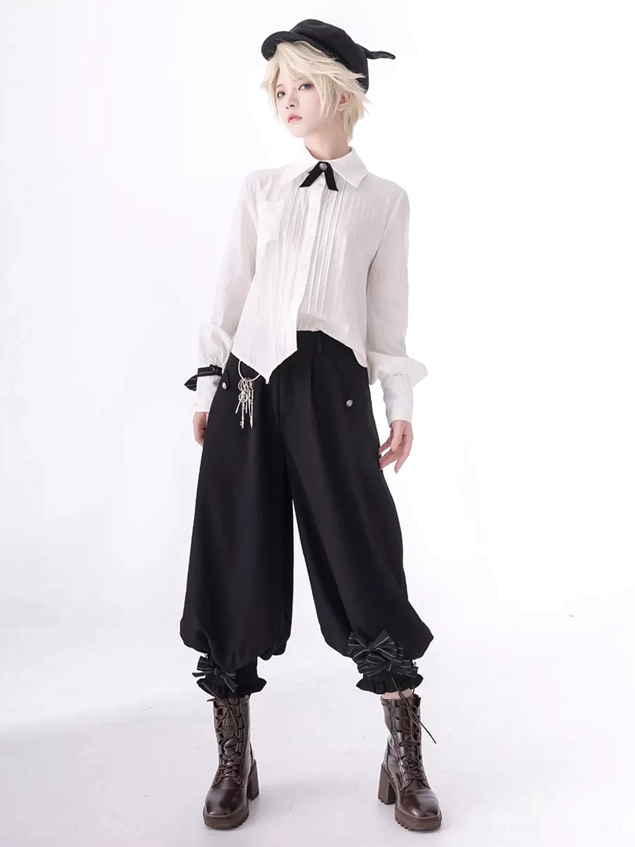 Gothic ouji lolita long sleeve blouse with bow details front view on androgynous model wearing pointed hem white shirt with black bow tie