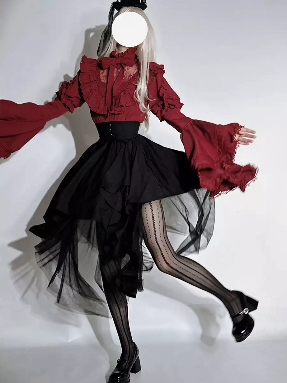 Dynamic side view of Gothic Ouji Lolita coord with model leg lifted showing asymmetrical black tulle skirt movement striped sheer tights and dramatic bell sleeves