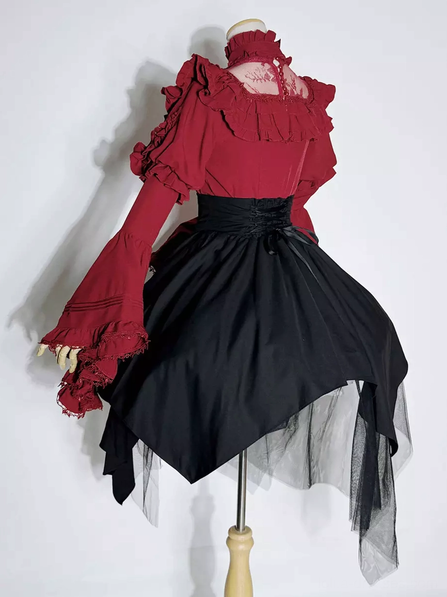 Back three-quarter mannequin view of Gothic Ouji Lolita two-piece set displaying ruffled red stand-collar top black asymmetrical tulle skirt and garment construction details