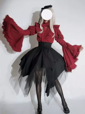 Back three-quarter view of Gothic Ouji Lolita outfit showing wide red ruffled sleeves asymmetrical black tulle skirt and structured waist design worn by blonde model