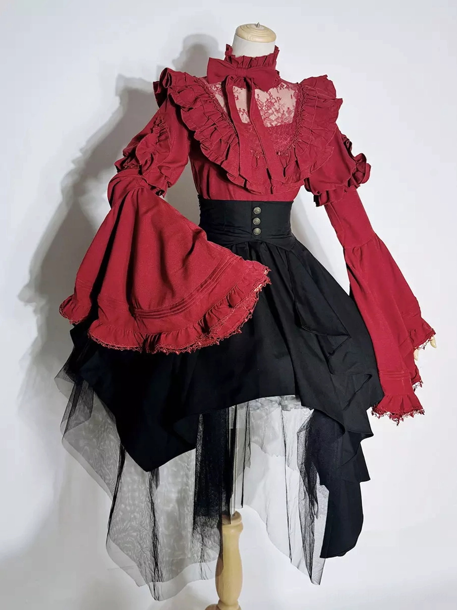 Mannequin display of Gothic Ouji Lolita blouse and skirt set showing wine red ruffled stand-collar top corset-style black waist asymmetrical tulle skirt construction