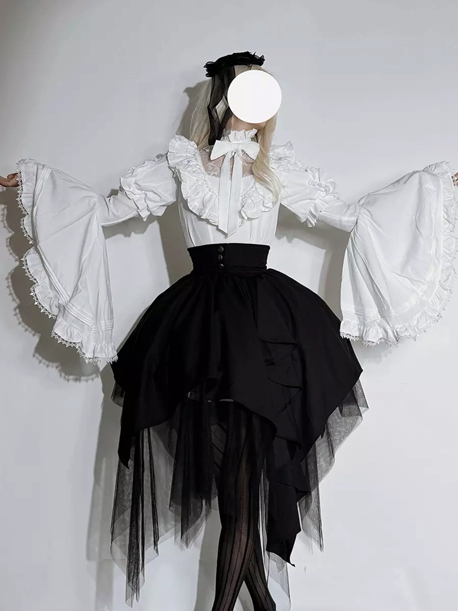 White version Gothic Ouji Lolita coord set front view with model wearing spread-arm pose showing white ruffled bow blouse black asymmetrical tulle skirt elegant contrast