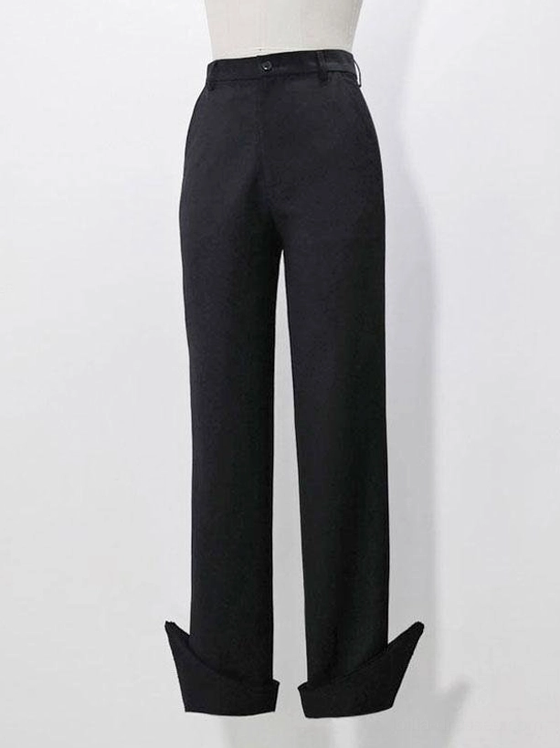 Gothic Ouji straight-leg pants flat lay front view showing folded trouser cuffs metal details and bow embellishments black polyester