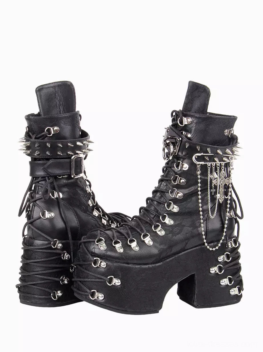 Punk gothic platform boots side three-quarter angle showing spiked ankle strap hanging chain pendants and lace-up eyelets with chunky wedge sole