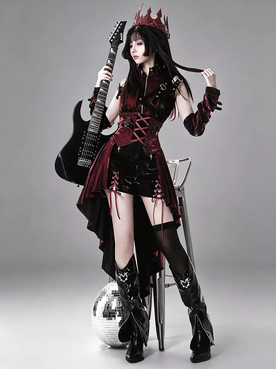 Gothic punk lolita dress three-quarter side view showing detachable arm cuffs and asymmetrical high-low skirt with matching knee-high boots