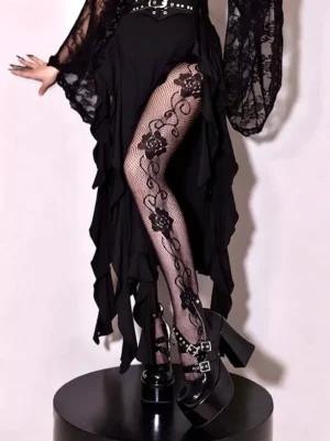 Black rose vine lace fishnet pantyhose front facing leg shot with ruffled gothic dress on display stand