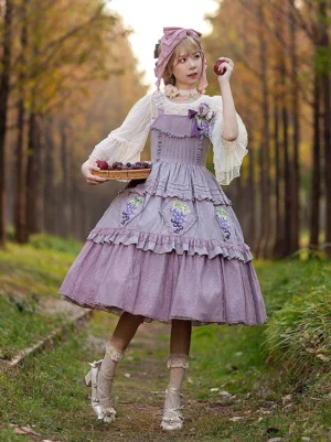 Light purple grape embroidered Classic Lolita dress with tiered ruffled skirt and lace trim - front oblique view worn by model in autumn forest setting