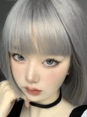 Gray blunt bob lolita wig with straight bangs worn by model in maid outfit - front close-up portrait view