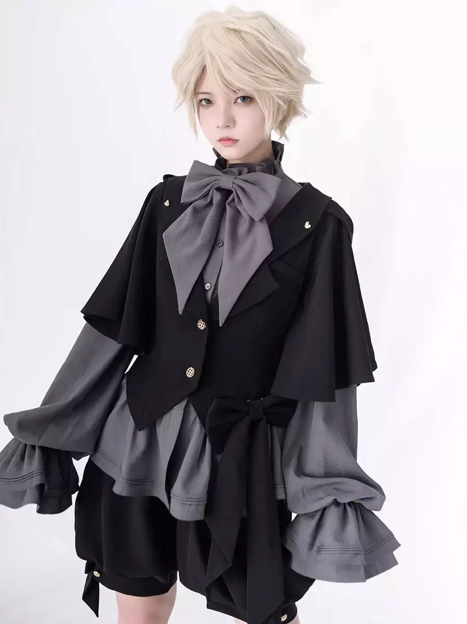 Gray gothic ouji blouse half body close up details gold buttons oversized bow tie layered ruffled sleeves