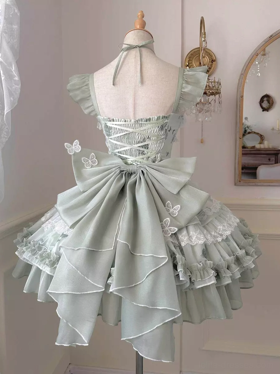 Green fairy lolita JSK dress back view showing lace-up corset back large layered bow halter strap detail