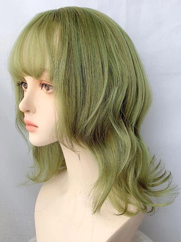 Green wavy lolita wig with soft air bangs shown from left profile view, white background display highlighting texture and length