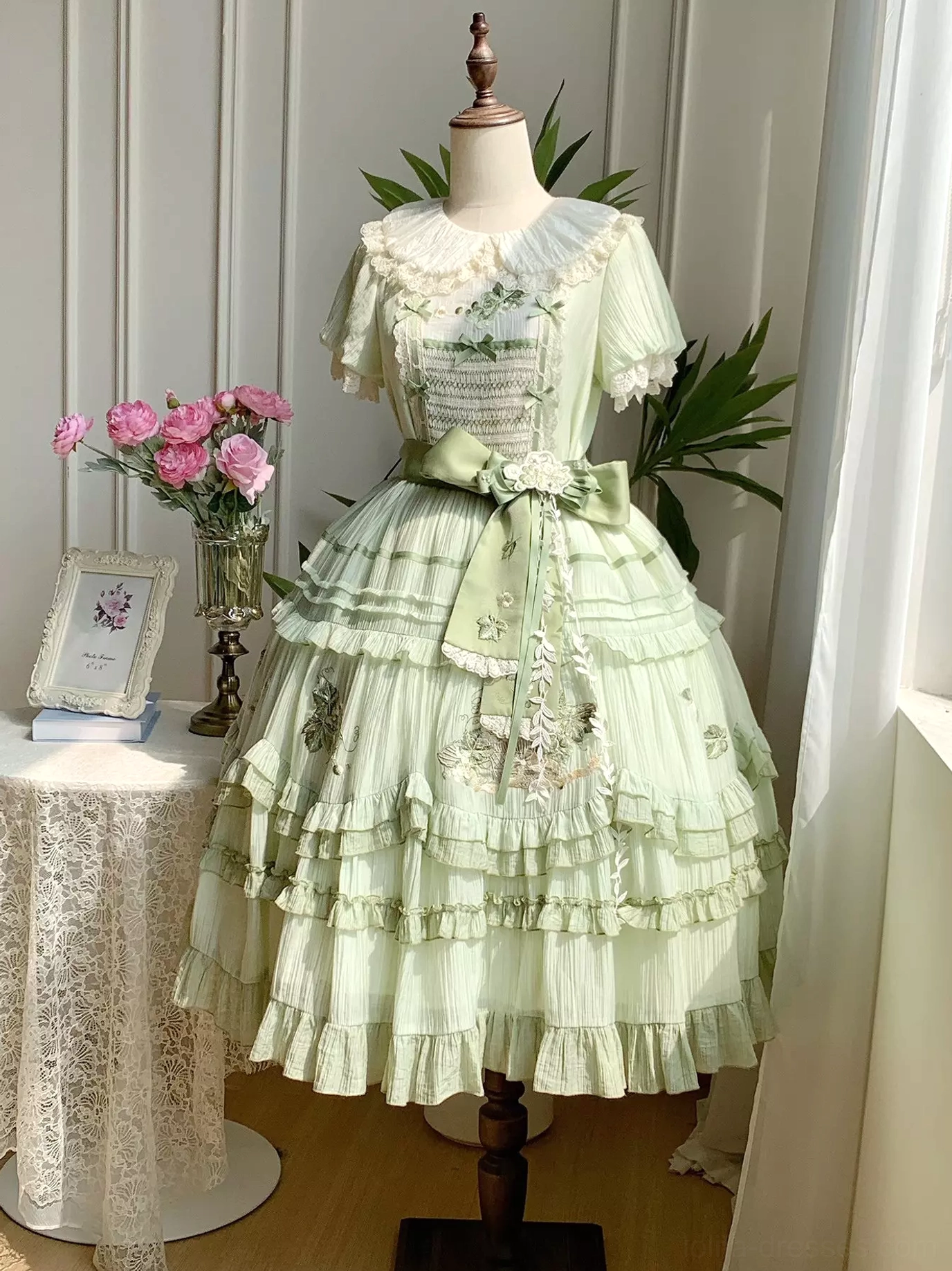 Green sweet lolita dress fabric texture and embroidery detail showcase featuring polyester material quality, floral embroidery pattern, ruffle construction, and premium craftsmanship