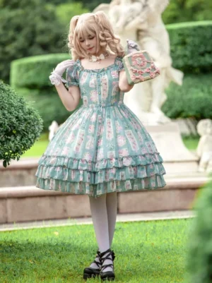 Front three-quarter view of enchanted garden green sweet Lolita dress with square neckline, puffed short sleeves, tiered ruffled skirt, and floral print pattern in outdoor garden setting