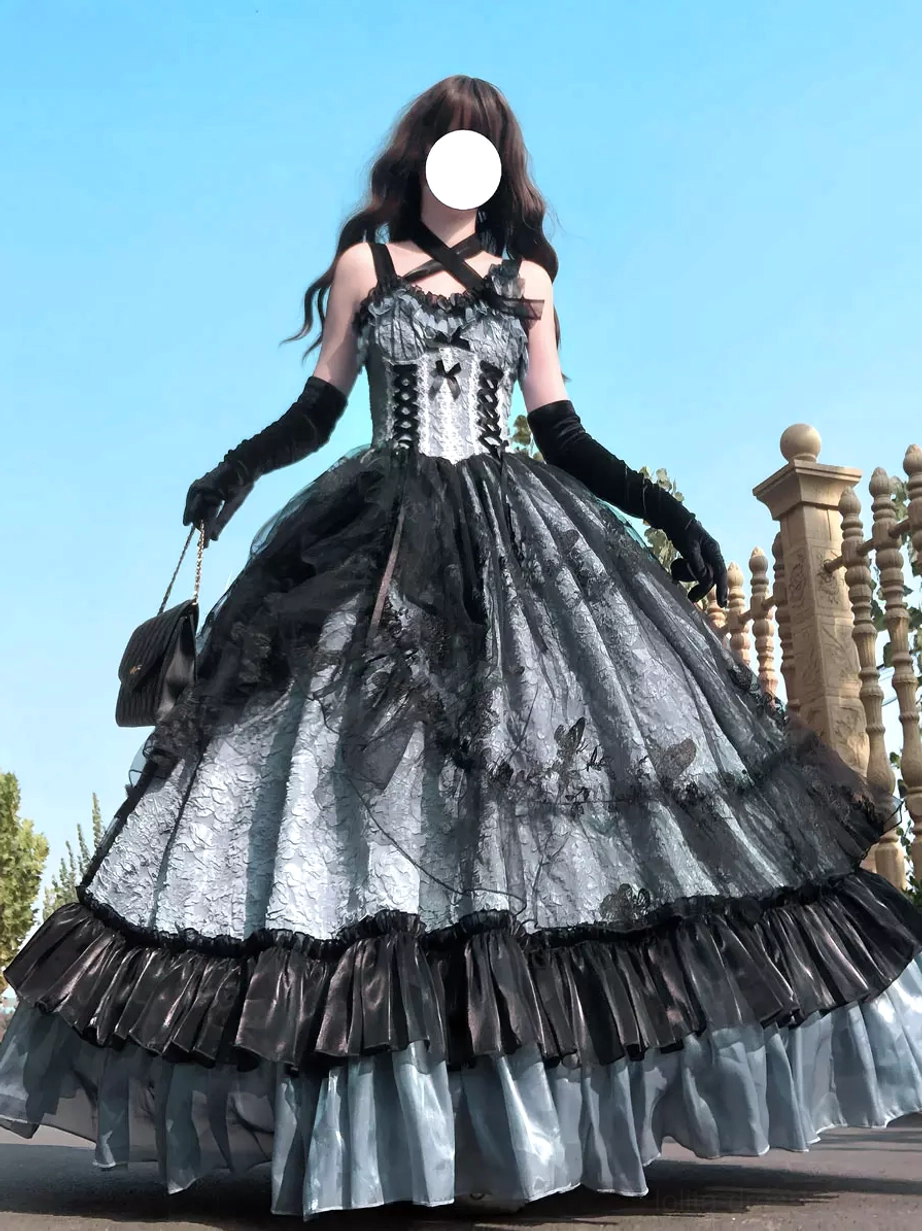 Side-front model view of grey and black gothic Lolita JSK dress with multi-layered ruffled hem and chain bag accessory