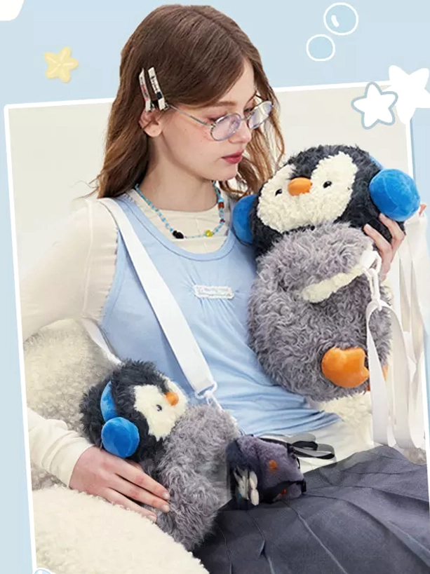 grey penguin plush crossbody bag side view on model wearing blue vest white adjustable shoulder strap lolita fashion