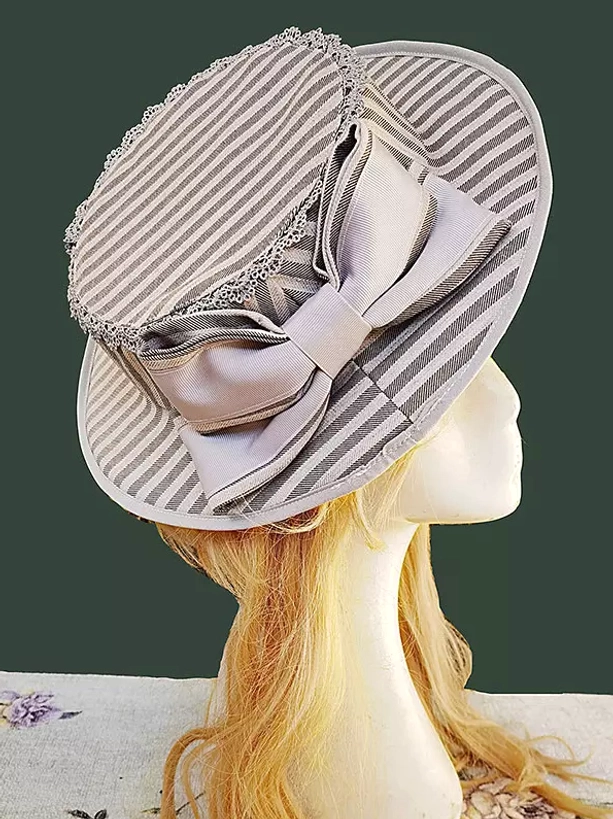 Grey and white striped lolita flat-top hat with light grey bow, elegant classic lolita accessory with lace brim trim on blonde mannequin