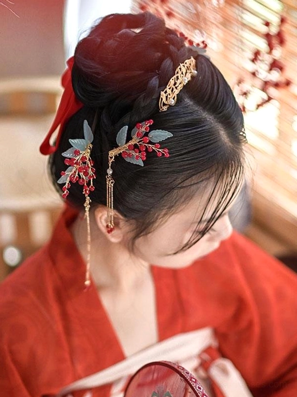 Back view of Hanfu hairstyle featuring braided bun adorned with gold metal hardware, red bead clusters, frosted light blue resin leaves, and hanging tassel chains with decorative details