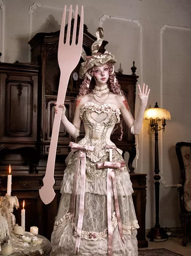 Heart-bust ivory lolita dress with layered lace skirt, pink bow sashes and styled accessories, showcasing sweet lolita fashion aesthetic
