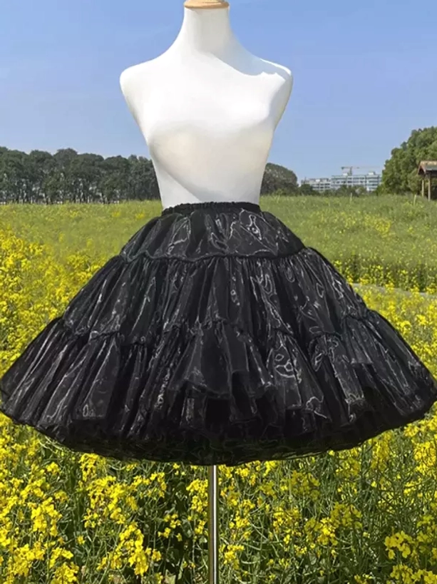 High-waisted black tiered petticoat front view showing multi-layer ruffled design and full silhouette for lolita fashion