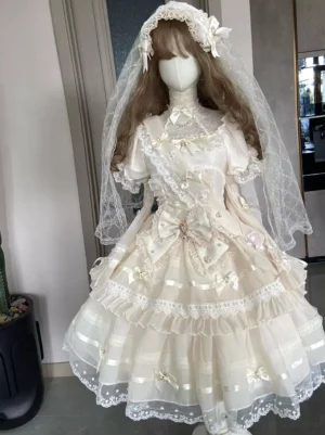 Hime Lolita bridal dress front medium shot detail showing structured bodice high collar puffed sleeves and decorative front bow embellishments