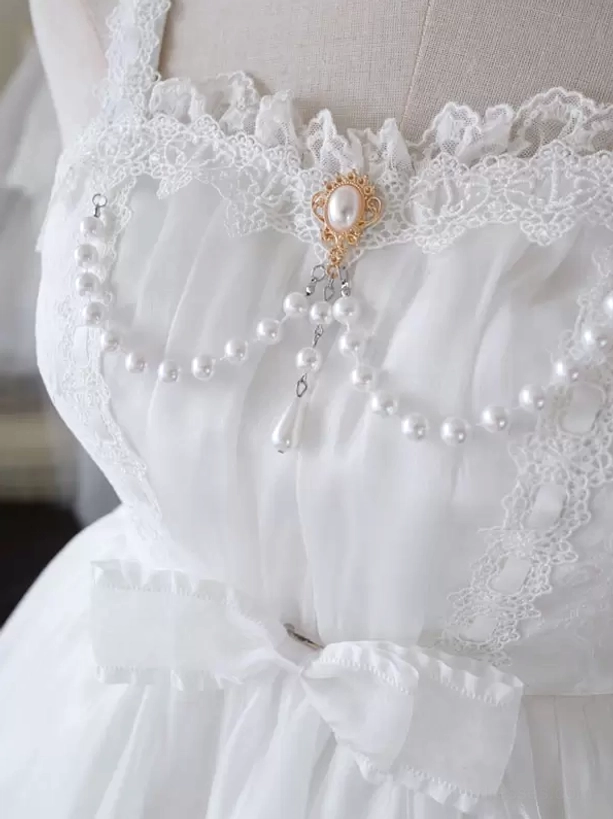 Sweet Hime Lolita jumper dress detail shot showcasing lace embellishment, pearl decoration, and premium polyester fabric texture with ruffled layers