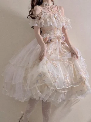 Off-the-shoulder Hime Lolita bridal dress front three-quarter angle view, featuring layered apricot tulle ball gown skirt with pearl embellishments and romantic ruffled collar on dark-haired model