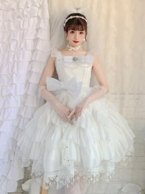 Enchanted Hime sweet Lolita jumper dress in ecru white with tiered ruffles and pearl lace detailing, front full-body view on model