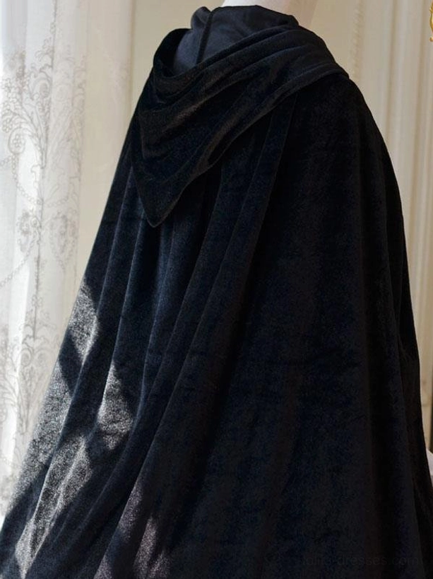 Hooded black velvet lolita poncho back view showcasing draped silhouette and soft matte velvet texture on mannequin