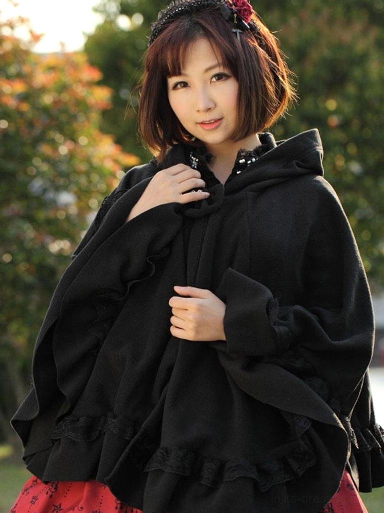 Bust-up shot of hooded lolita cape coat featuring star neck fastener with red hair accessory and ruffled hem detail