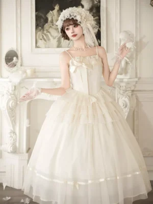 Ivory fairy tale spaghetti strap tiered tulle lolita maxi dress with front bow detail, full three-quarter view showcasing romantic tiered silhouette in vintage palace setting