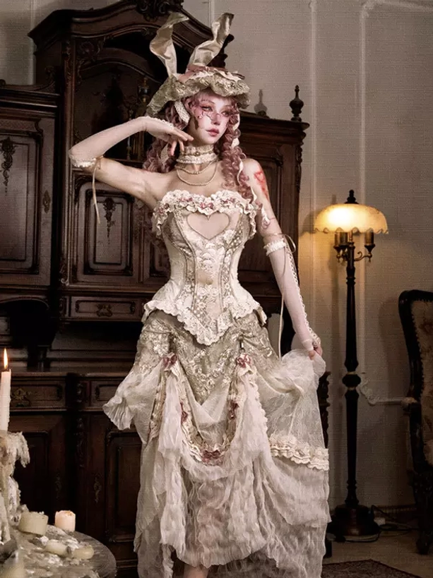 Cream lace boned corset with layered ruffled skirt side view showing structured bodice and vintage indoor setting