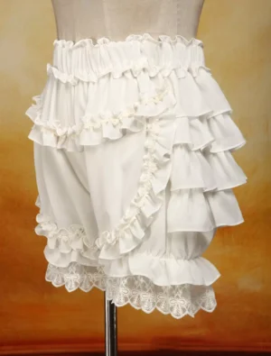 Left side view of ivory chiffon bloomers displaying multi-layer ruffled leg design, side ruffled straps, and lace-trimmed hems on dress form