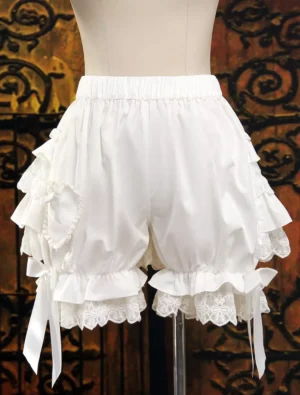 Ivory Lolita bloomers front view with layered ruffles lace trim and heart-shaped pocket detail on mannequin vintage backdrop