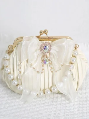 ivory off-white rococo lolita kiss-lock purse front view sheer pleated bow rhinestone center decoration pearl trim details