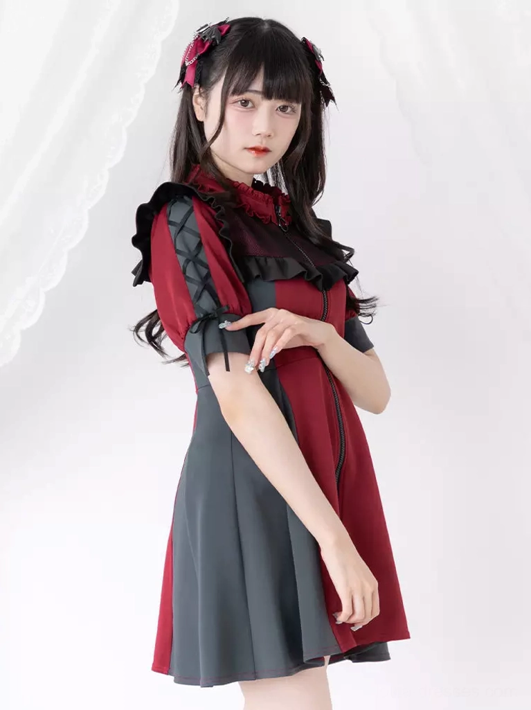 Red and dark gray color block lolita dress side front three-quarter view showing ruffled shoulder panels drawstring sleeve details and front zip