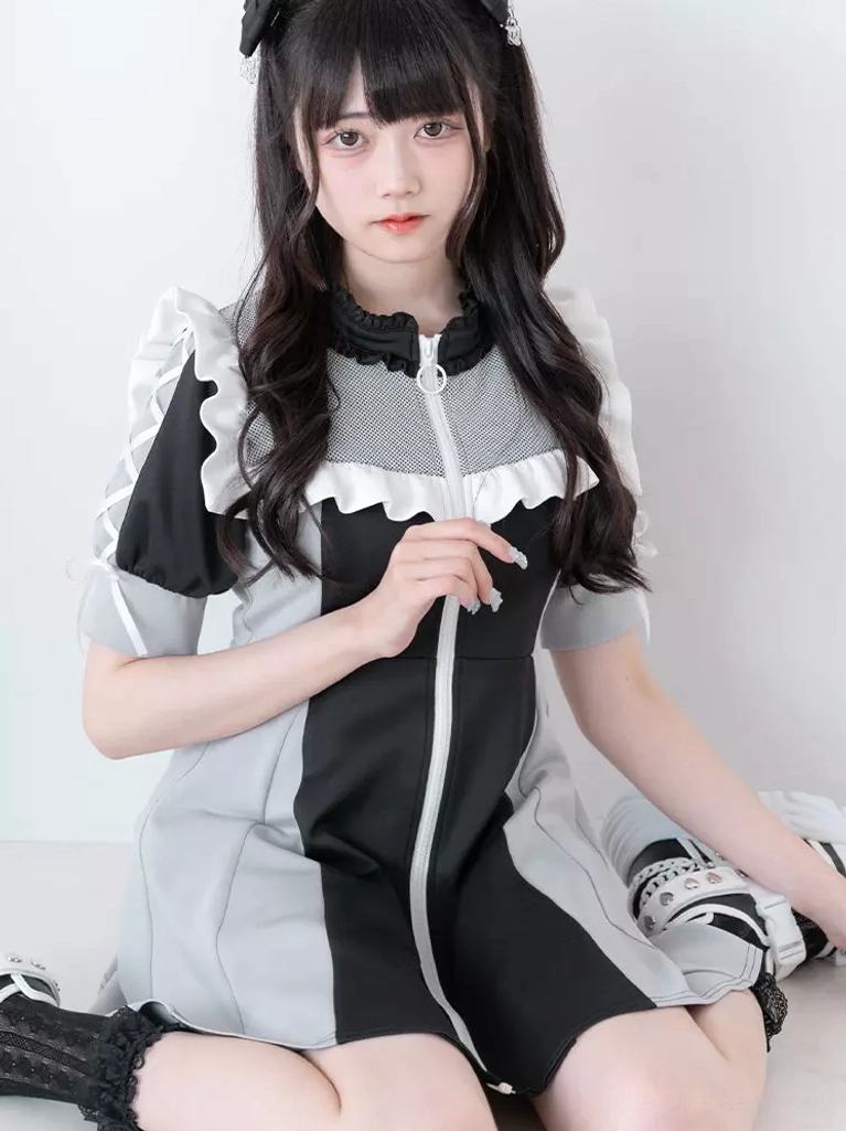 Black and light gray contrast lolita dress front sitting view featuring mesh ruffled collar white ruffle trim front zip closure and puff short sleeves