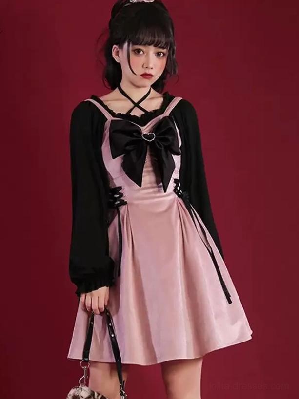 Two-tone Jirai Kei gothic lolita dress with color-block design, black long puff sleeves, large black chest bow, and cross halter neckline, full front view