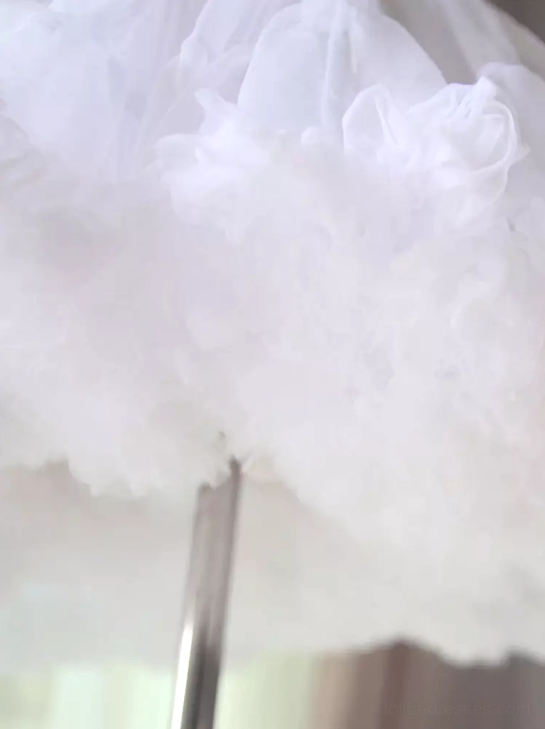 Jumbo white tulle lolita petticoat side close-up view metal display stand bright white extremely layered fluffy tulle construction