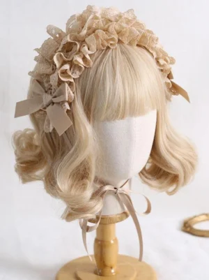 Khaki beige ruffled lace Lolita headdress with floral lace pattern and matching bow accents on mannequin with curly blonde wig, wooden display stand